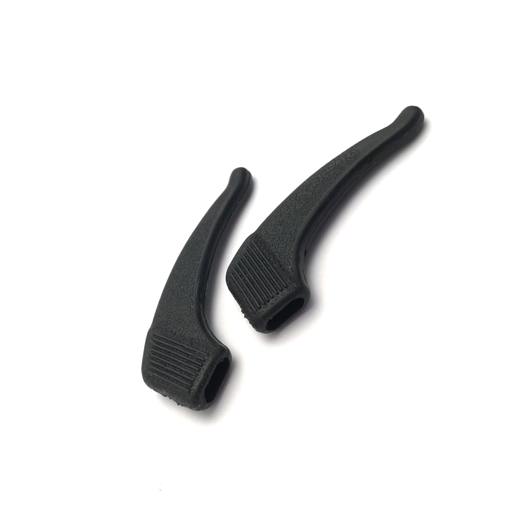 two black temple tip extenders for loupes placed next to each other
