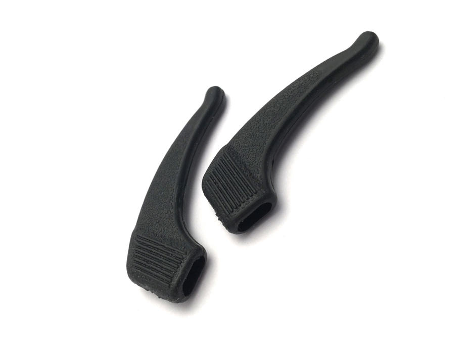 two black temple tip extenders for loupes placed next to each other